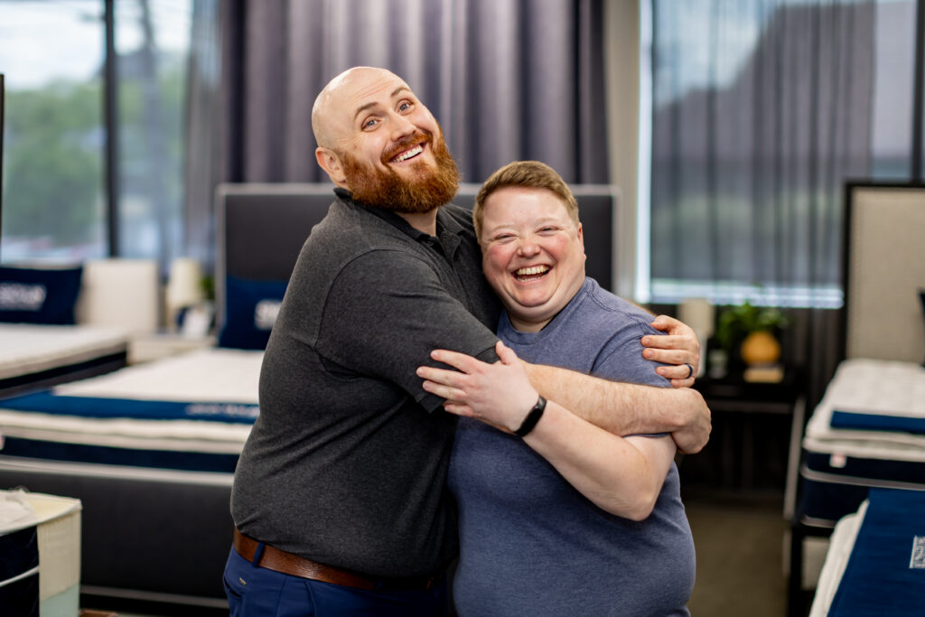 employees hugging each other
